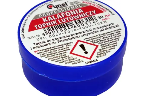 Profesjonalny topnik lutowniczy w niebieskim słoiczku. Etykieta informuje, że jest to kalafonia, co to jest i do czego służy.