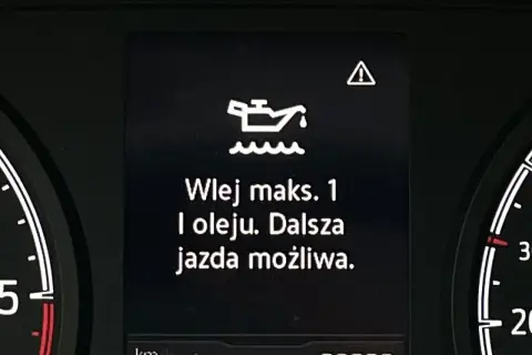 Kontrolka oleju z falą: "Wlej maks. 1 l oleju. Dalsza jazda możliwa." ostrzega o niskim poziomie smarowania.