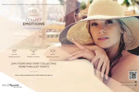 Mujer con sombrero de paja disfruta del sol, invitando a coleccionar emociones con MeliáRewards.