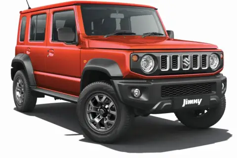 Pomarańczowy Suzuki Jimny 5-drzwiowy, idealny na przygody. Sprawdź jego cenę i możliwości!