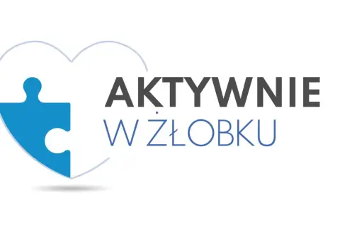 Niebieski element puzzla w kształcie serca z napisem "AKTYWNIE W ŻŁOBKU".