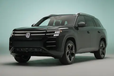 Nowy, ciemny Volkswagen Atlas z nowoczesnymi światłami LED i charakterystycznym grillem.