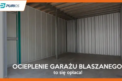 Wnętrze pustego garażu blaszanego z betonową posadzką i metalowymi ścianami.