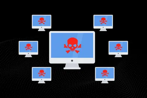 Komputery z czerwonymi czaszkami na ekranach, otaczające większy monitor. Symbolizuje to atak DDoS, gdzie wiele urządzeń jednocześnie próbuje przeciążyć cel.