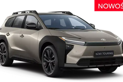 Nowy, beżowy Toyota bZ4X Touring z czarnymi dodatkami i relingami dachowymi, gotowy na każdą podróż.