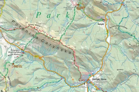 Mapa turystyczna Bieszczad z zaznaczonymi szlakami, schroniskami i punktami widokowymi. Widać Połoninę Caryńską i Bereżki.