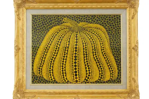 A vibrant yellow pumpkin, a signature motif of the spotted pumpkin artist, is depicted in this framed artwork. The pumpkin is covered in black dots, set against a black background with yellow netting.