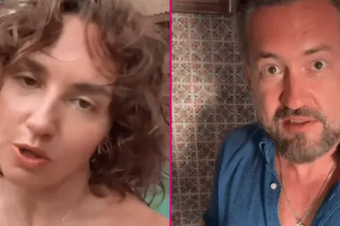 Marcin Prokop z córką, która ma kręcone włosy i patrzy wprost.