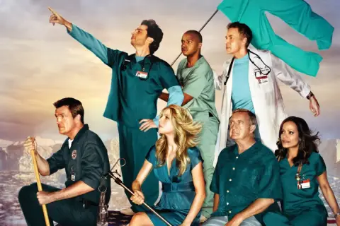 Cast di Scrubs in posa epica, con un medico che indica l'orizzonte. Una recensione di scrubs che cattura lo spirito della serie.