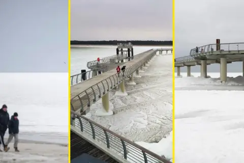 Spacerem po zamarzniętym Bałtyku, kiedy był skuty lodem. Widok na molo i plażę w zimowej scenerii.