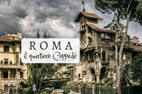 Edifici fiabeschi e fontana nel quartiere Coppedè a Roma, sotto un cielo nuvoloso.