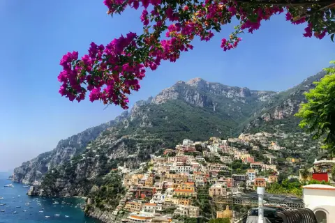 A stunning view of Positano, a colorful cliffside village on the Amalfi Coast, perfect after your trip from Naples airport.