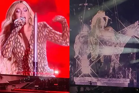 Beyoncé w błyszczącym stroju śpiewa na scenie, a obok niej widać jej sylwetkę na tle scenografii w kształcie konia. Niezapomniany koncert!