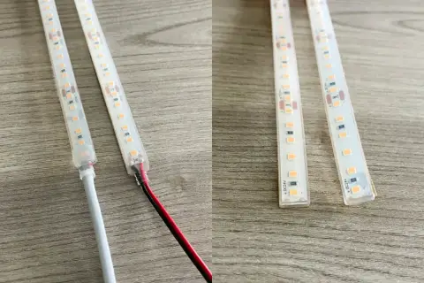 Dwie taśmy LED z widocznymi połączeniami i przewodami, jedna z białym kablem, druga z czerwonym i czarnym.