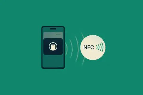 Telefon z ikoną płatności zbliżeniowych i symbolem NFC, gotowy do szybkiego transferu danych.