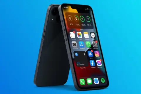 Ekran główny iPhone z widocznymi ikonami aplikacji i widżetem baterii.