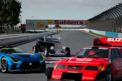Trzy samochody wyścigowe na torze, w tym niebieski Suzuki, czerwony Suzuki i czarny hot rod. Grafika z gry Gran Turismo na PC.