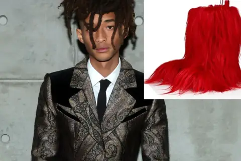 Jaden Smith, syn Willa Smitha, w ekstrawaganckim garniturze obok jaskrawoczerwonych, futrzanych butów.