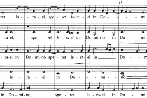 Extrait de partition musicale montrant un exemple de polyphonie vocale avec les paroles "Israel in Domino".