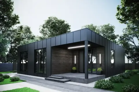 Nowoczesny dom modułowy 100m2 cena pod klucz, z czarną elewacją i drewnianymi akcentami, otoczony zielenią.