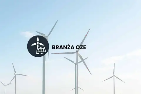 Wiatraki i panele słoneczne symbolizują branżę OZE. Dowiedz się, co to jest OZE i jak wpływa na przyszłość energetyki.