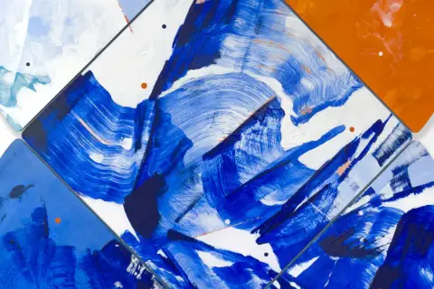 Vibrant abstract art examples featuring bold blue brushstrokes on white, with pops of orange and subtle pink accents.