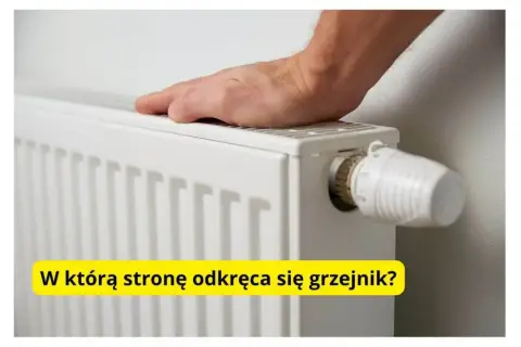 Dłoń na grzejniku, obok termostatu. Pytanie brzmi: w którą stronę się odkręca grzejnik, by było cieplej?