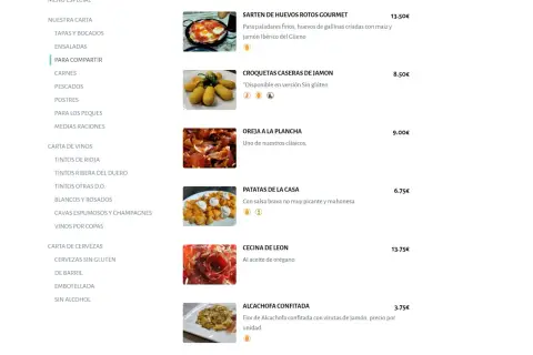 Menu z daniami: jajka z szynką 13,50€, krokiety 8,50€, uszy wieprzowe 9€, ziemniaki 6,75€. Czy w Hiszpanii jest drogo? Ceny sugerują, że można zjeść smacznie i w rozsądnej cenie.