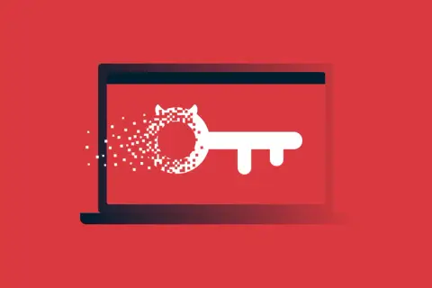 Laptop z kluczem, którego część rozpada się na piksele. To wizualizacja tego, czym jest malware.