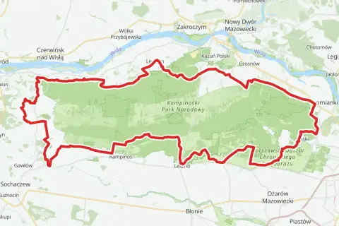 Mapa z zaznaczonym Kampinoskim Szlakiem Rowerowym, biegnącym przez Kampinoski Park Narodowy, w pobliżu Wisły i miejscowości takich jak Zakroczym czy Ożarów Mazowiecki.