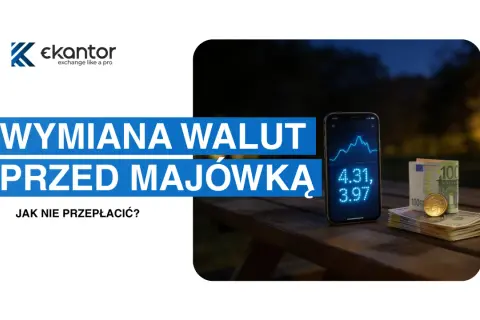 Jak działa kantor internetowy? Na stole leży telefon z wykresem kursów walut, obok stos banknotów i moneta. Wymiana walut przed majówką.