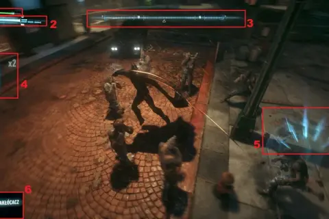Batman walczy z przeciwnikami w Arkham Asylum. Poradnik pokazuje interfejs gry: PD, pasek zdrowia, kompas, gadżety, celownik.