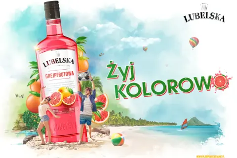 Lubelska litr grejpfrutowa na plaży, z ludźmi tańczącymi i balonami na niebie. Żyj kolorowo!