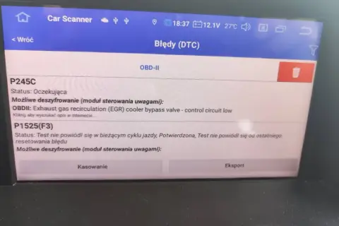 Ekran skanera diagnostycznego pokazuje błąd DTC P1525 w Renault, dotyczący zaworu obejściowego chłodnicy EGR.
