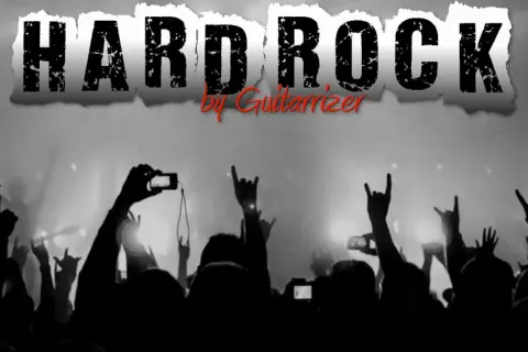 Tłum fanów z rękami w górze, pozdrawiający ulubione hard rock zespoły. W tle napis "HARD ROCK".