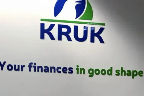 Logo firmy KRUK z hasłem "Your finances in good shape".