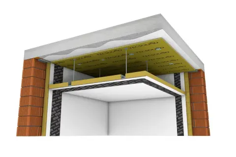 Detalle constructivo de aislamiento acústico. Se observa la distancia entre forjado y falso techo, con materiales aislantes y placas de yeso.