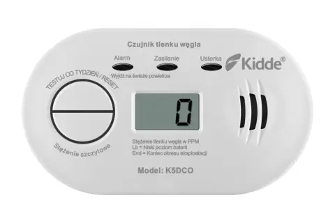 Biały czujnik tlenku węgla Kidde z wyświetlaczem pokazującym "0" i przyciskiem Test/Reset.