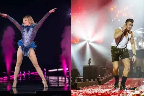 Helene Fischer und ein Mann in Lederhosen auf Bühne. Deutsche Lieder, die jeder kennt, werden hier gefeiert.