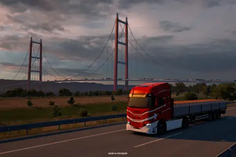 Czerwona ciężarówka na moście, zachód słońca. Idealna grafika do sprawdzenia wymagań Euro Truck Simulator 2.