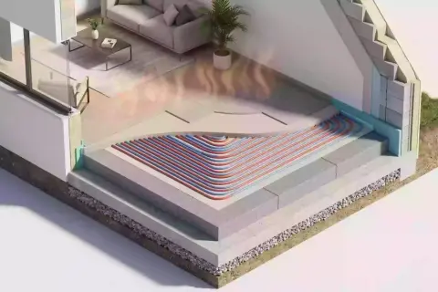 Coupe d'une maison montrant le chauffage par le sol et l'isolation vide sanitaire.