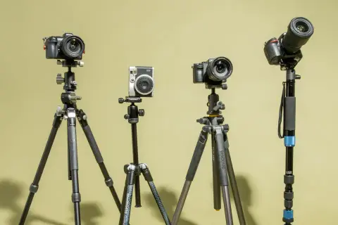 Four cameras on tripods, showcasing options for how to choose a tripod for your photography needs.