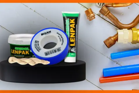 Materiały hydrauliczne: taśma teflonowa, pasta do gwintów Lenpak i mufa miedziana.