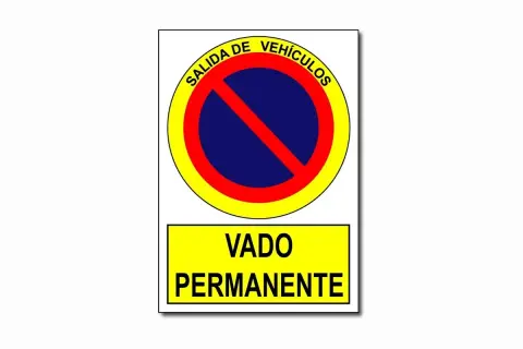 Señal de "Salida de Vehículos" y "Vado Permanente", indicando que es un vado señalizado y no se puede aparcar.