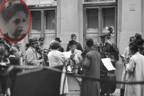 Kobieta w okręgu, zespół grający na ulicy. Muzycy z instrumentami, jakby po pracy, jak siekiera motyka, w tle budynek.