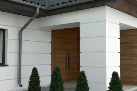 Nowoczesny dom z białym tynkiem i drewnianymi elementami. Eleganckie boniowanie elewacji podkreśla architekturę.