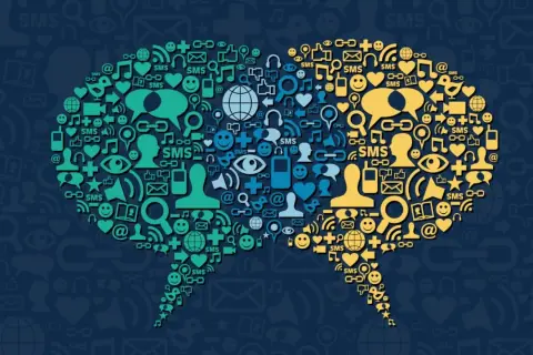 Deux bulles de dialogue composées d'icônes symbolisant la communication et les réseaux sociaux, illustrant la tendance réseaux sociaux.
