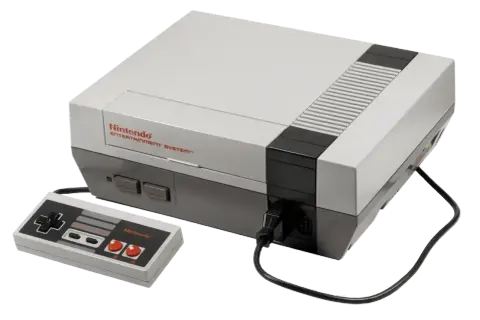 Konsola Nintendo Entertainment System z padem, klasyka **gier z dzieciństwa na komputer**.