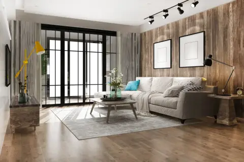 Soggiorno moderno con divano beige, tavolino in legno, tappeto grigio e parete effetto legno. Un esempio di come arredare casa con poco, puntando su pochi elementi ben scelti.