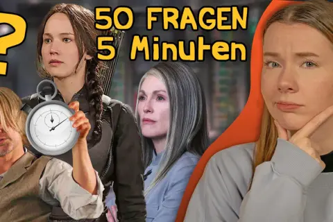 Die Besetzung von Die Tribute von Panem: Jennifer Lawrence, Woody Harrelson, Julianne Moore und eine nachdenkliche Frau. Ein Stoppuhr-Symbol deutet auf eine Zeitfrage hin.